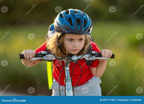 Kid Riding Bike in a Helmet. Child Riding Bike in Protective Helmet ...