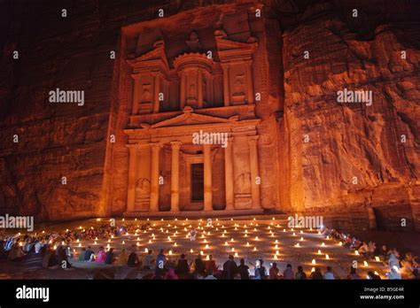 Night view of candles burning at Facade of Treasury Al Khazneh Petra ...