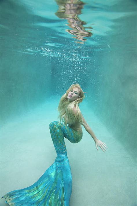 Mermaid Swimming Under Water Art Print by Ariel Skelley - Photos.com