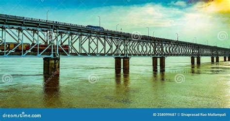 Train and Bus Passes through Road Railway Bridge Over the Godavari River at Sunset, Rajahmundry ...