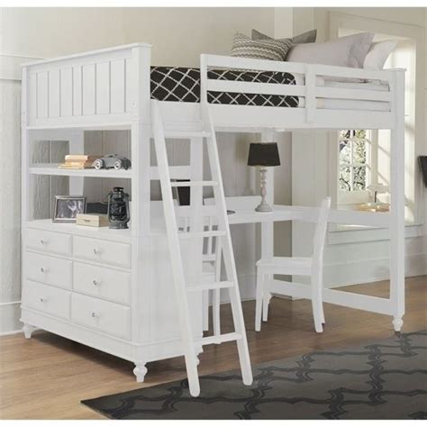 a white bunk bed sitting next to a desk with a ladder on top of it