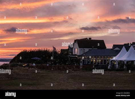 Sunset at Beachcomber Cafe, along the Hampshire coastal path near Barton-on-Sea looking out ...