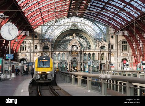 2018-10-01 Antwerp, Belgium: Monumental train hall of Antwerp Central Station with platform ...