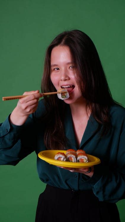 Woman Eating Sushi in Studio · Free Stock Photo