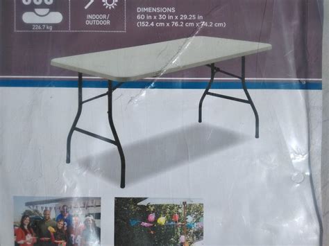 LOT 10 NEW 5 FOOT FOLDING TABLE | EstateSales.org