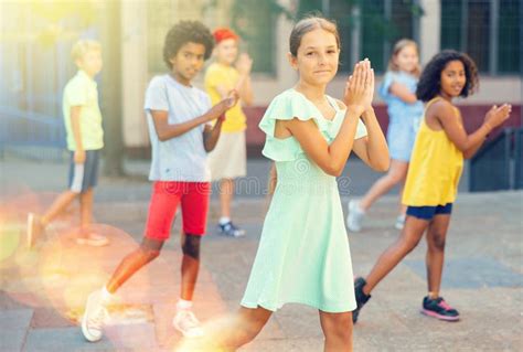 Happy Girl Dancing with Group of Tweenagers on City Street Stock Image - Image of hipster ...