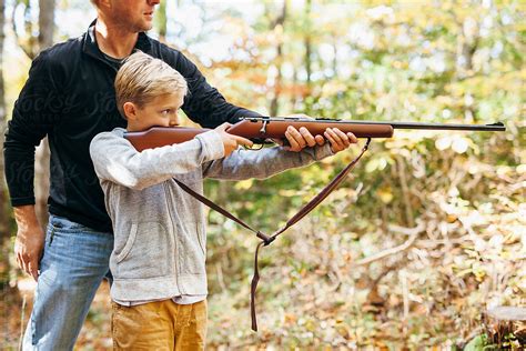 "Father Teaching His Son How To Shoot A Rifle" by Stocksy Contributor ...