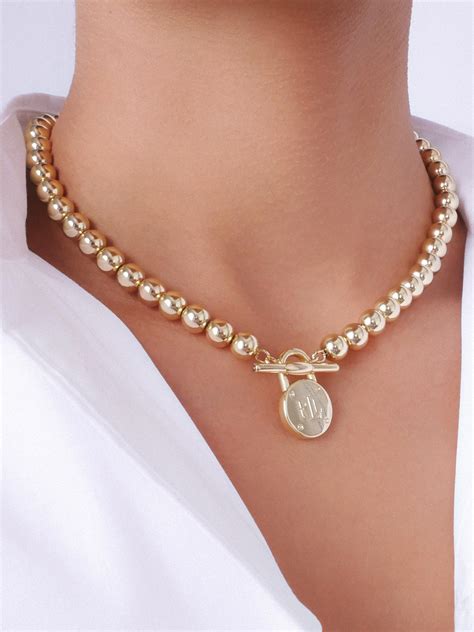 Women's Lauren by Ralph Lauren Gold Tone Beaded Toggle Necklace with ...