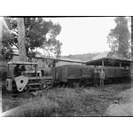 Fordson tractor converted to a rail shunter, shunting two wagons full ...