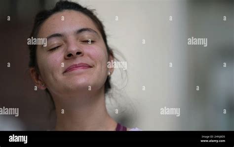 Woman closing eyes in meditation calm person looking at sky Stock Photo - Alamy