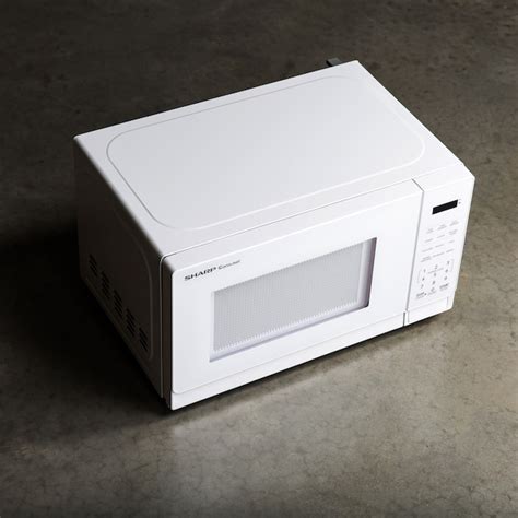 Sharp 0.7-cu ft Small 700-Watt Countertop Microwave (White) in the ...