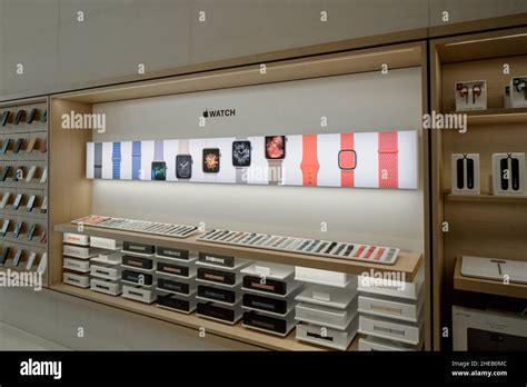 Paris, France - Circa 2019: Large group of accessories shopping inside the Apple Store Champs ...