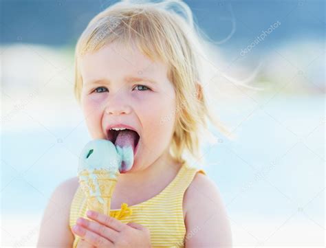 Happy baby eating ice cream Stock Photo by ©CITAlliance 30060213