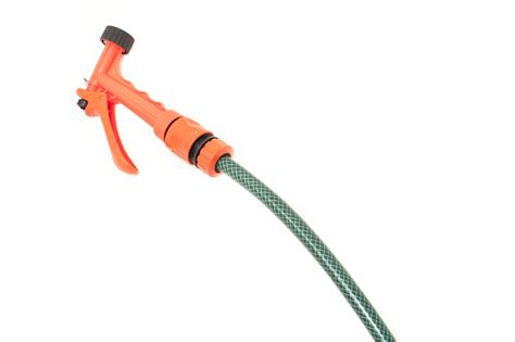 Free Image of Green plastic garden hose and orange nozzle | Freebie ...