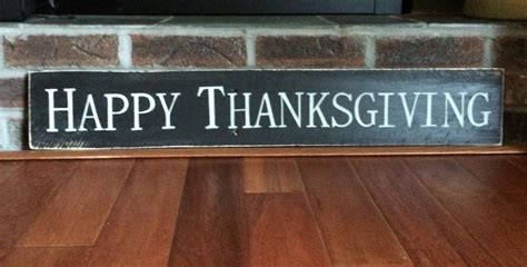 Rustic Happy Thanksgiving sign handpainted on a piece of