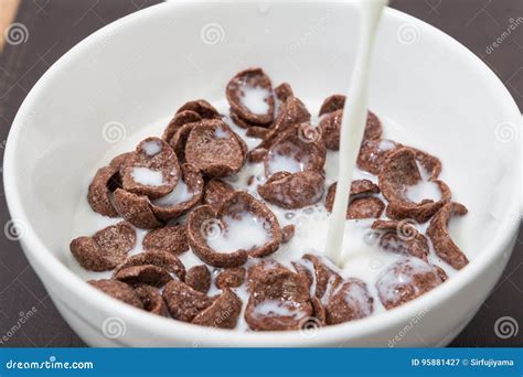 Pouring milk into cereal stock image. Image of healthy - 95881427