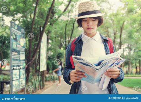 Young Woman Traveler Hand Hold and Look Map Stock Photo - Image of beautiful, smiling: 124620998