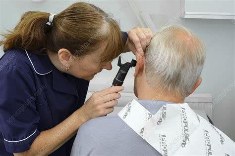 Ear examination - Stock Image - C018/1012 - Science Photo Library