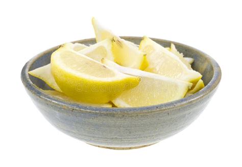 Lemon wedges in old bowl stock photo. Image of peeling - 28639086