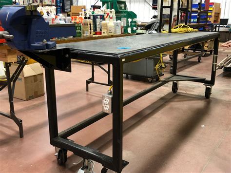 Heavy duty custom rolling workbench 96" x 24" x 36" c/w 8" vise, wired with receptacles