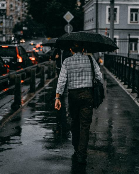 Man Walking With Umbrella · Free Stock Photo