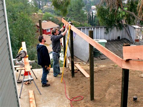 How to Build a Horizontal Plank Fence in a Hillside Backyard | HGTV