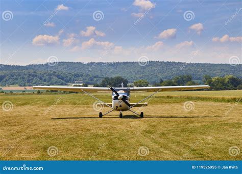 Front View of Cessna 172 Airplane Standing on Grass Field with Blue ...