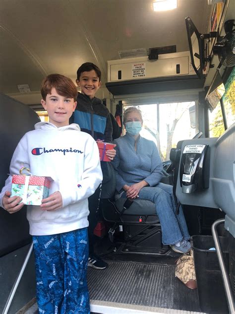 'My kids': Bus drivers deliver gifts after school closes | AP News