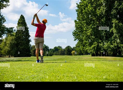 Hitting the perfect golf shot Stock Photo - Alamy