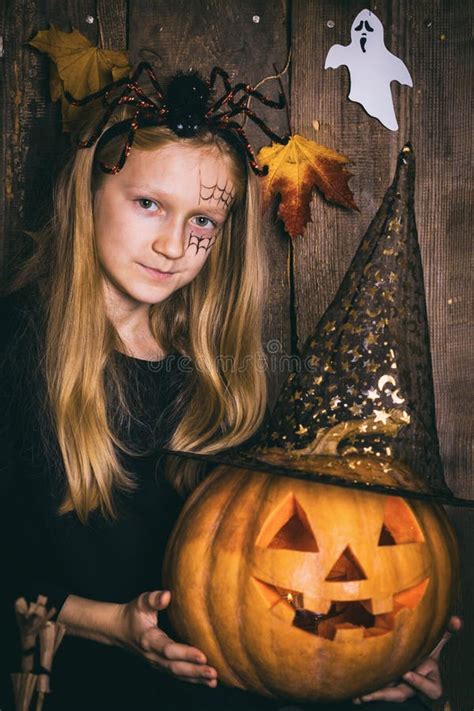 Halloween Girl with a Pumpkin Stock Image - Image of face, magic: 159931835