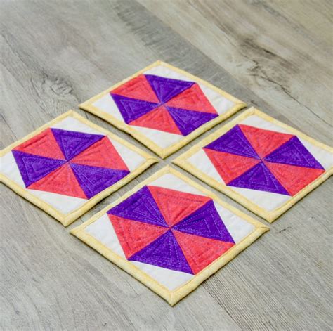 Set of four quilted coasters with a traditional... - Folksy