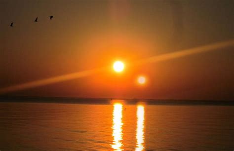 Sunset of Two Suns, orange, suns, dusk, nature, sunset, reflection, sea, star, HD wallpaper | Peakpx