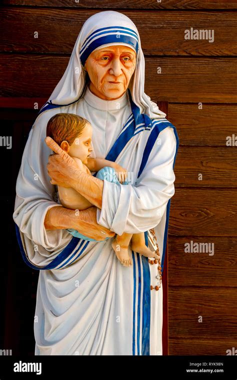 Statue depicting Mother Teresa holding a child in the Missionaries of Charity's convent ...