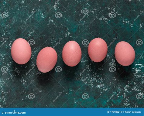 Pink Chicken Eggs on a Dark Green Background. Easter Concept ...