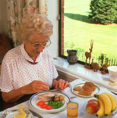 Elderly Woman Eating Healthy Meal Photograph by Sheila Terry/science Photo Library