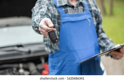 Car Mechanic Delivering Car Keys After Stock Photo 2239710541 | Shutterstock