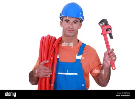 Plumber with a tool Stock Photo - Alamy