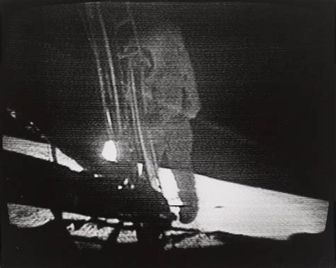 Neil Armstrong descends the ladder of the lunar module, about to become ...