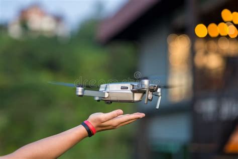 Drone Copter Flying with Digital Camera Near Hand. Stock Photo - Image of misty, propeller ...