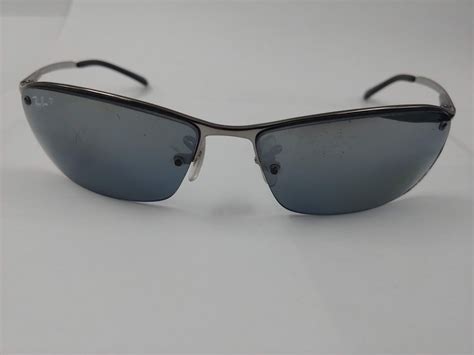 PAIR OF AUTHENTIC POLARIZED RAY-BAN SUNGLASSES (RB3183) - Able Auctions