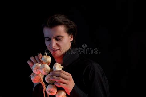 Evil Vampire with Scary Eyes is Licking Garlic Stock Image - Image of ...