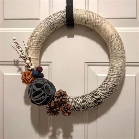 I got the yarn for this wreath from Joann fabrics. Added pinecones for a wintery touch ...