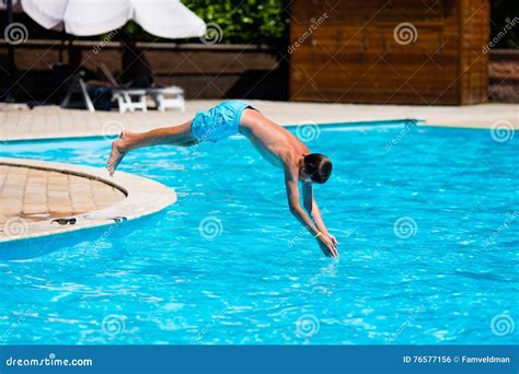 Boy Diving in Swimming Pool Stock Photo - Image of people, spring: 76577156