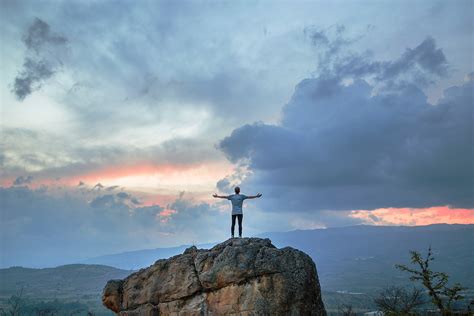 Boy standing on Mountain looking at clouds in Villa de Leyva image - Free stock photo - Public ...