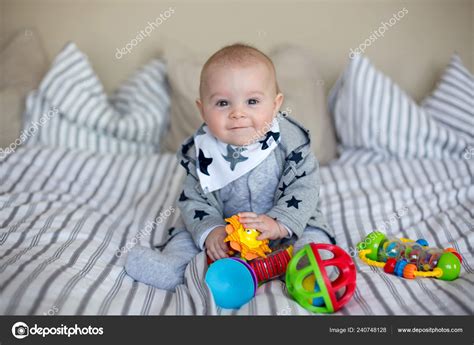 Cute Little Baby Boy Playing Home Bed Lots Colorful Toys Stock Photo by ...