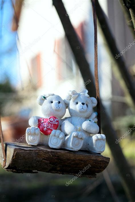 Teddy bear couple on a swing — Stock Photo © dianazh #9781155