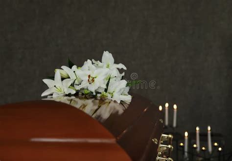 Wooden Casket with White Lilies in Funeral Stock Image - Image of funereal, home: 155788739