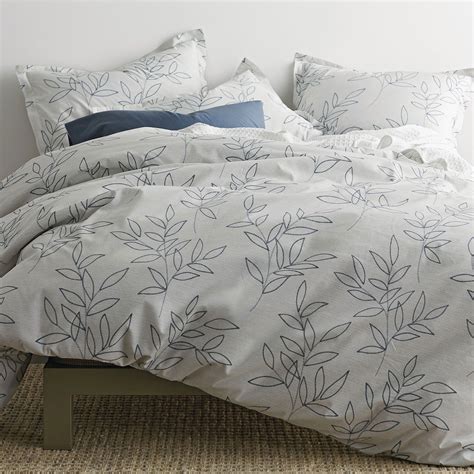 This beautiful organic duvet cover is printed with leafy vines floating ...