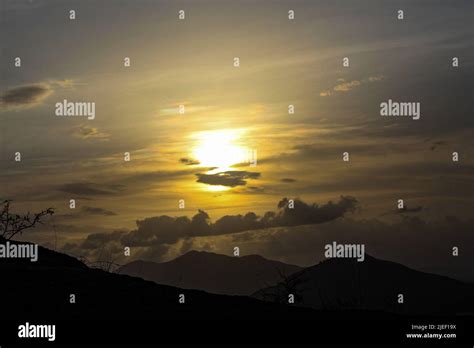 Sunset on the hill, couple in silhouette Stock Photo - Alamy