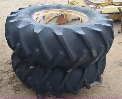 (2) 18.4-28 tractor tires and wheels in Kinsley, KS | Item AW9891 sold | Purple Wave